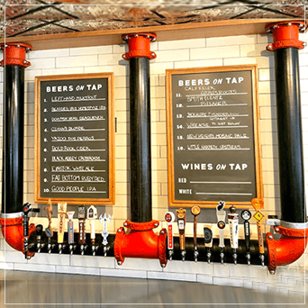 Hanging Draft Beer Towers In Front Of A Beer Menu