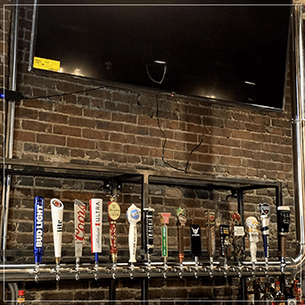 Hanging Draft Beer Towers With Taps Installed