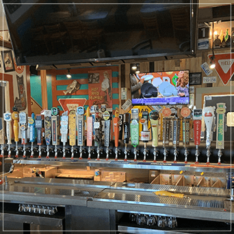 Hanging Draft Beer Towers with different types of taps